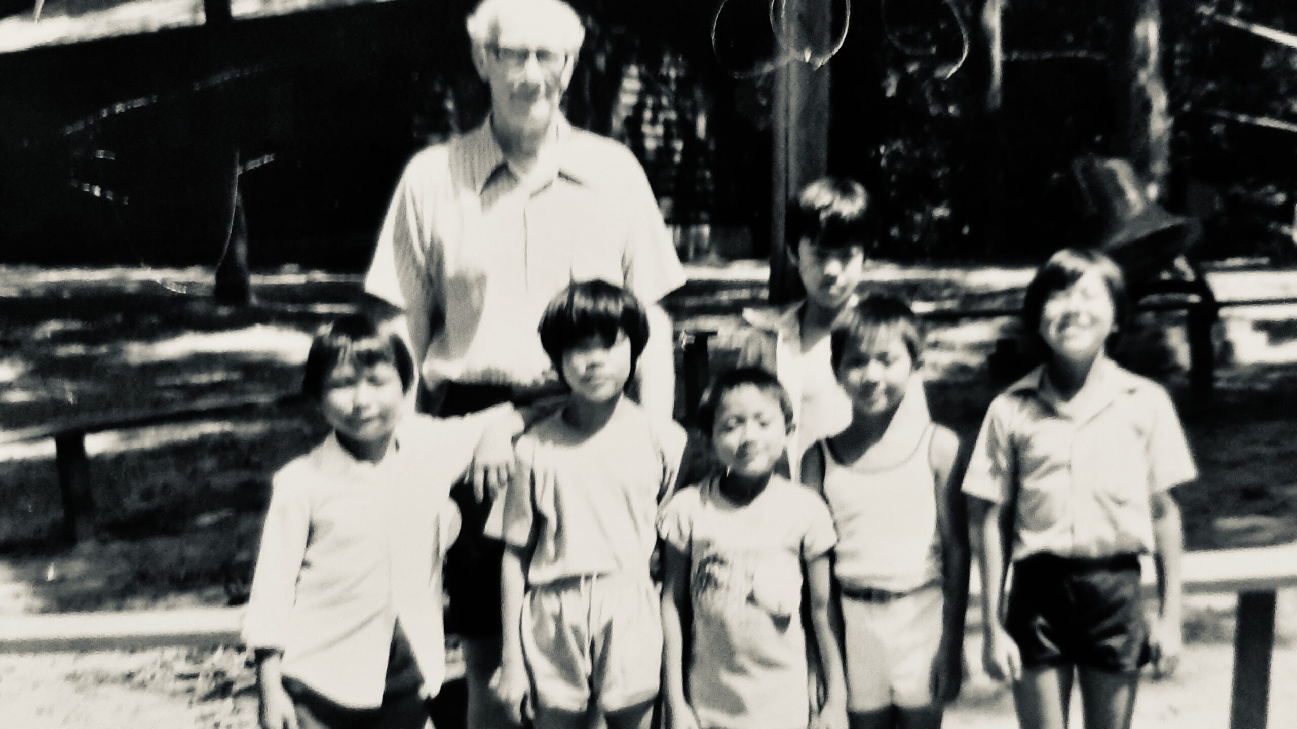 Family immigrating from Laos to USA pose for group photo