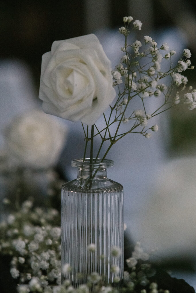 white rose combined with baby's breath on sweetheart table