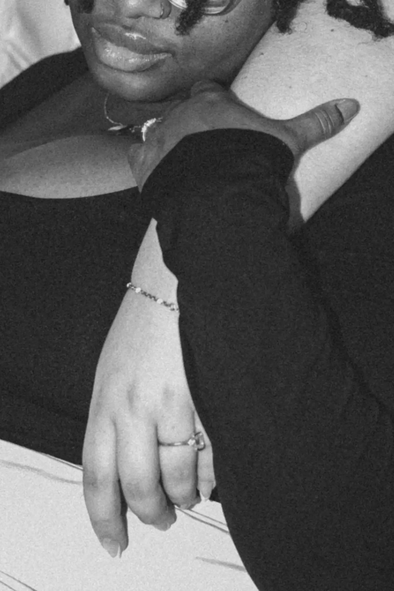 Monochrome photo close-up of hands with engagement ring