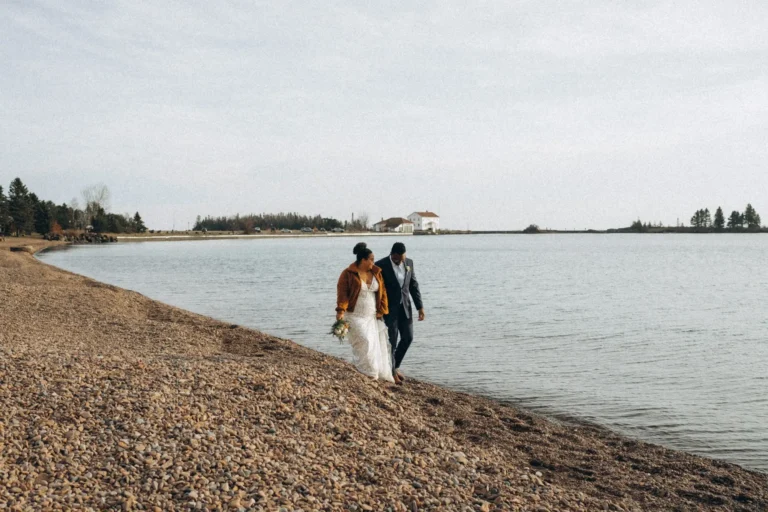 minnesota elopement couple walking alongside Lake Superior