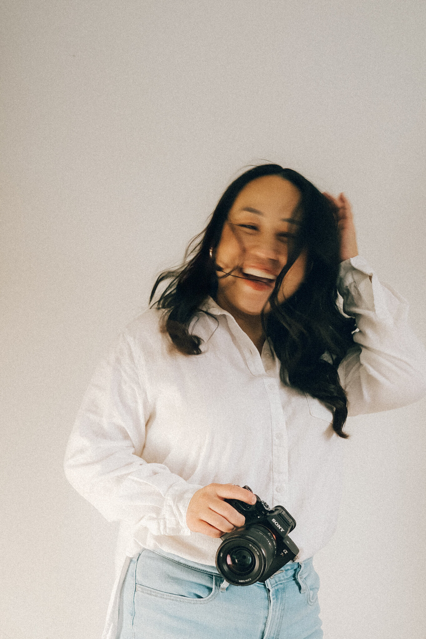 Minnesota elopement photography smiling at camera with camera in hand
